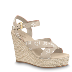 Look stylish this season with the Louis Vuitton Starboard Wedge Sandal - available at outlet, original, and new prices!