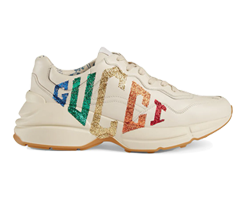 Buy women's Rainbow Glitter Gucci leather sneaker from original Gucci Rhyton outlet.