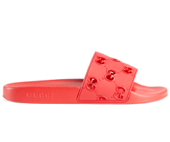 Alt Text: Gucci Women's Original GG Slide Sandal - a comfortable rubber flip flop for summer fun.