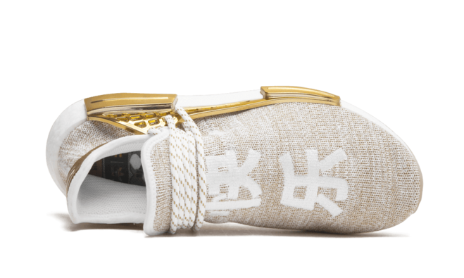 Get the Exclusive Men's Gold Human Race Holi MC NMD from Pharrell Williams | Shop Now.