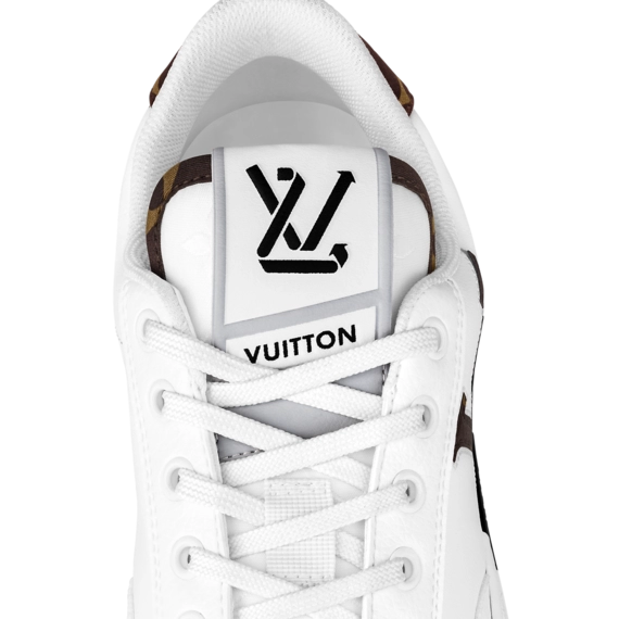 Women's Louis Vuitton Charlie Sneaker Original: An image of a woman's foot wearing a yellow, leather Louis Vuitton Charlie Sneaker.