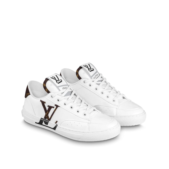 Buy Women's Original Louis Vuitton Charlie Sneaker: An image of a woman's foot wearing a pink, leather Louis Vuitton Charlie Sneaker.