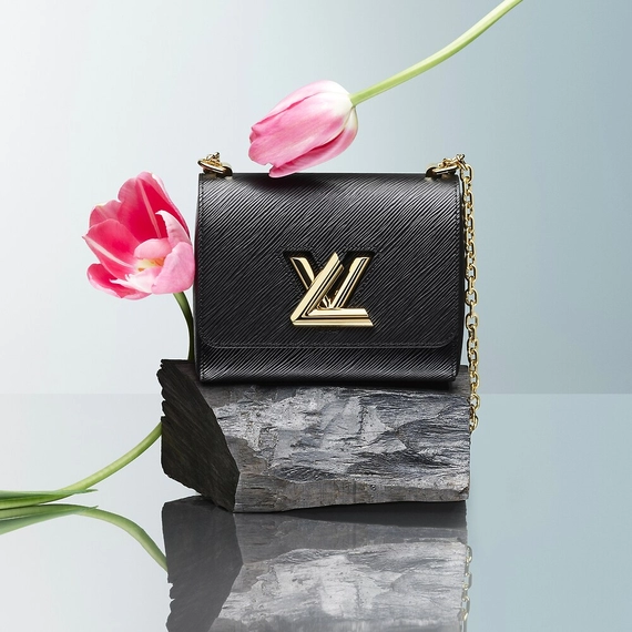 'Show off your style with a Louis Vuitton Twist PM bag!'