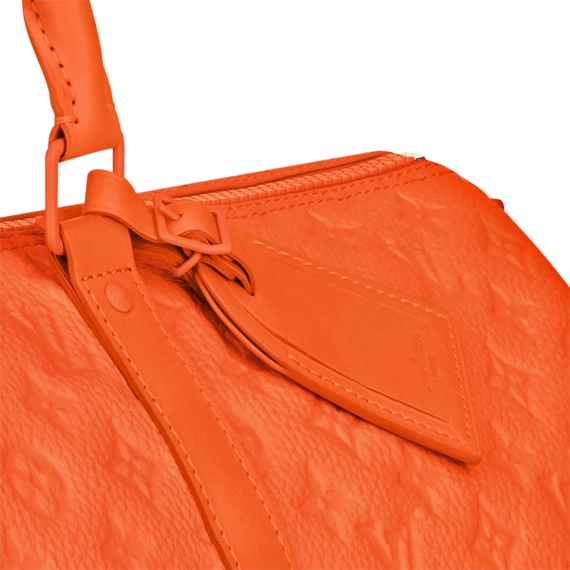 Visit the outlet to get the Louis Vuitton Keepall Bandouliere 50 Orange, a stylish bag for men