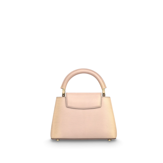 The Louis Vuitton Capucines Mini Light Pearly Gold - the perfect accessory for any modern woman!