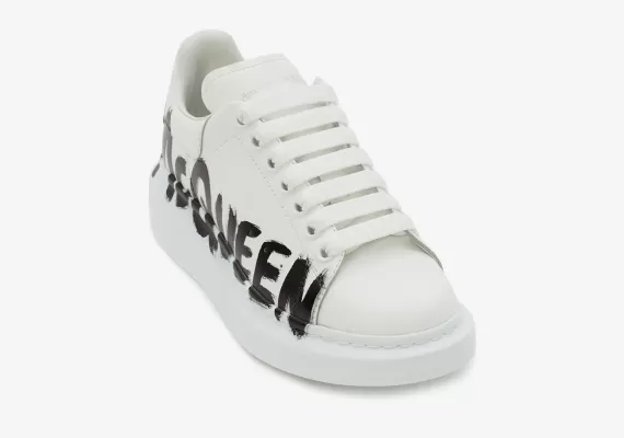 Get the Original Alexander McQueen Graffiti Oversized Sneaker in White/Black Here