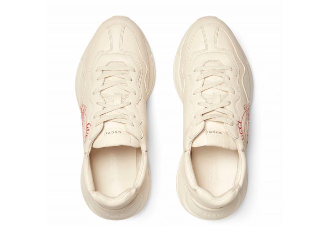 Get your Gucci Rhyton Print Leather Sneaker for men from the outlet.