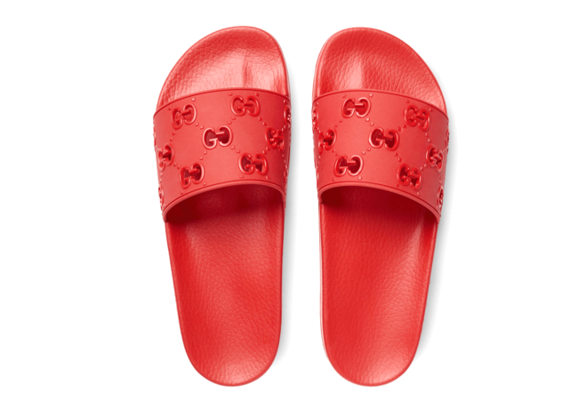 Alt Text: Find the perfect summer sandal for your wardrobe - the new Gucci Rubber GG Slide Sandal for women.