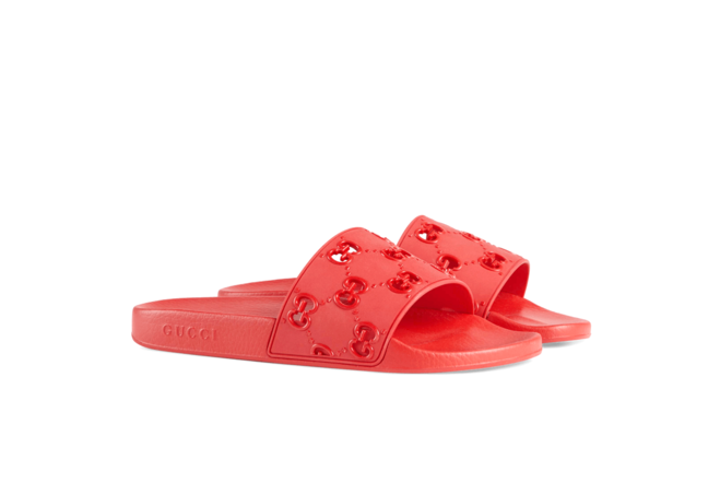 Alt Text: Refresh your closet with a new pair of Gucci Women's Rubber GG Slide Sandal.