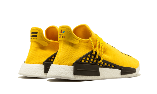 Shop the original Pharrell Williams yellow NMD Human Race shoes for men